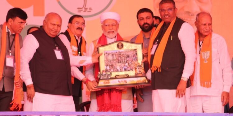 Upcoming Dhaman Gujarati movie's producer Bhupat Bodar presents memento to PM Modi behalf of his Dhaman team